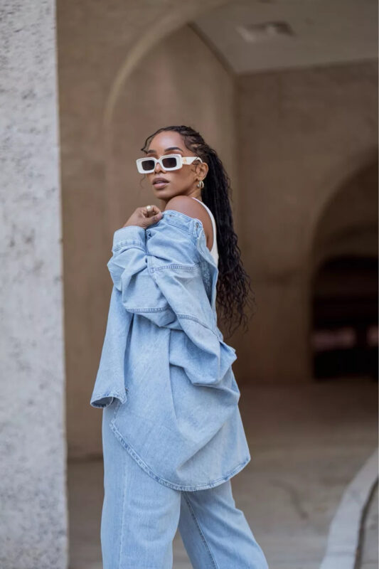 carmen posing in jean outfit